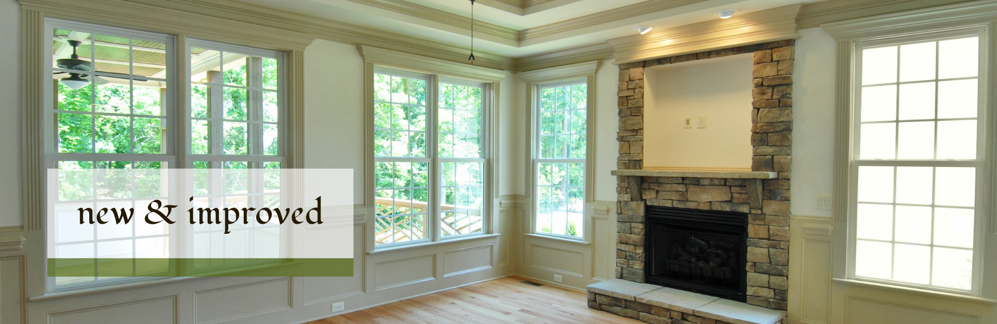 newly remodeled family room with a stone fireplace 